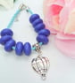Blue Plaited Leather Bracelet with Blue Wooden Beads and a Silver Balloon Charm