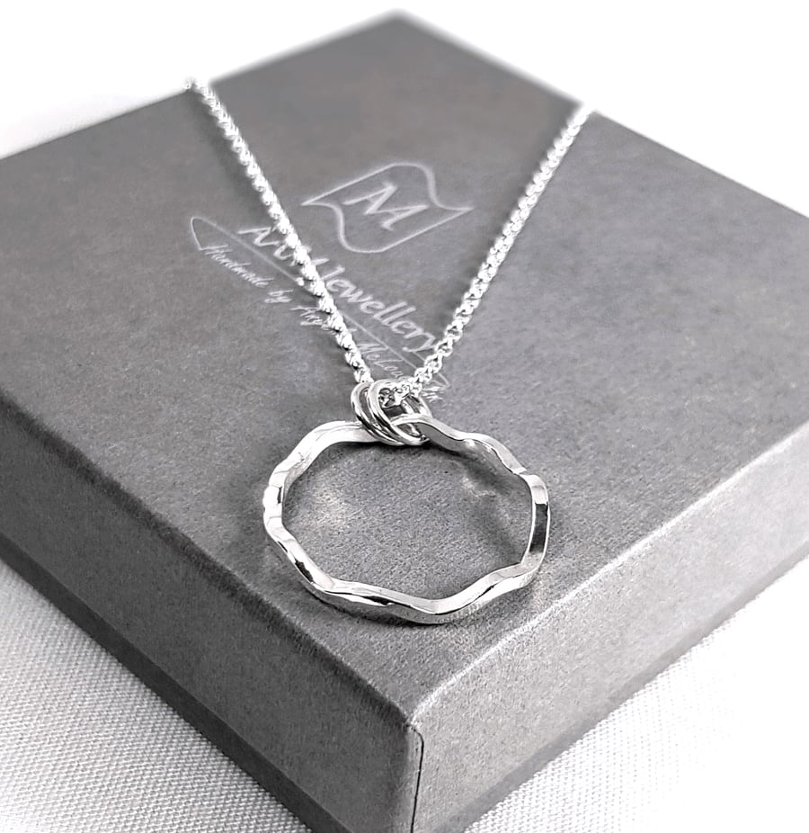 Sterling silver circle on sale pendant