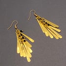 Drop shaped gold tone chandelier earrings with faceted black spinel stones