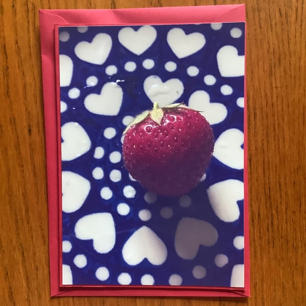 Handmade original photo card of the strawberry harvest on a decorative plate