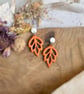 Autumn Minimalist Cutout Metallic Orange Polymer Clay Leaf Earrings - Image 1