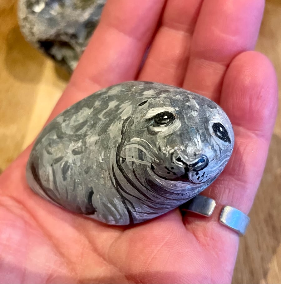 Painted seal on rock garden stone sea wildlife 