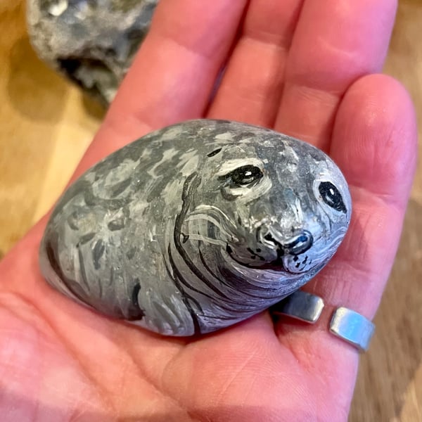 Painted seal on rock garden stone sea wildlife 