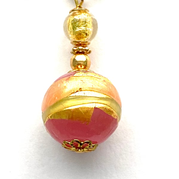 Gold Murano glass handmade rose decorated heart pendant with gold chain.