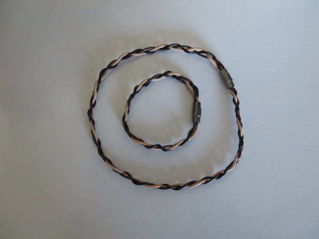 Matching choker with leather bracelet has magnetic clasp
