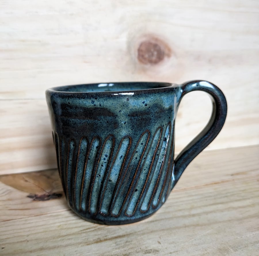 Dark greeny blue carved mug
