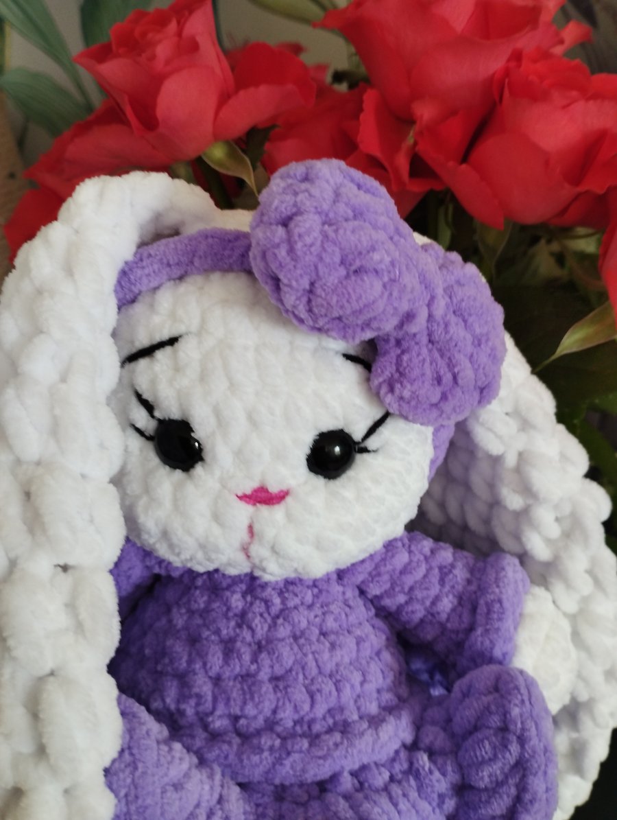 Crochet wonderful amigurumi bunny rabbit in a bright dress
