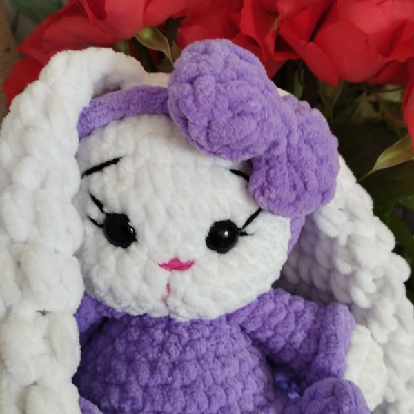 A wonderful amigurami bunny rabbit in a bright dress