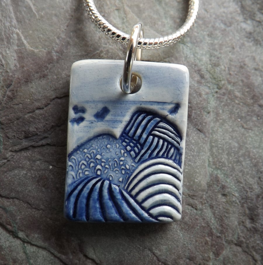 Tiny ceramic Mountains pendant in blue and white 