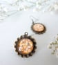Vintage Style Dangle Earrings with Flower Art - Image 1