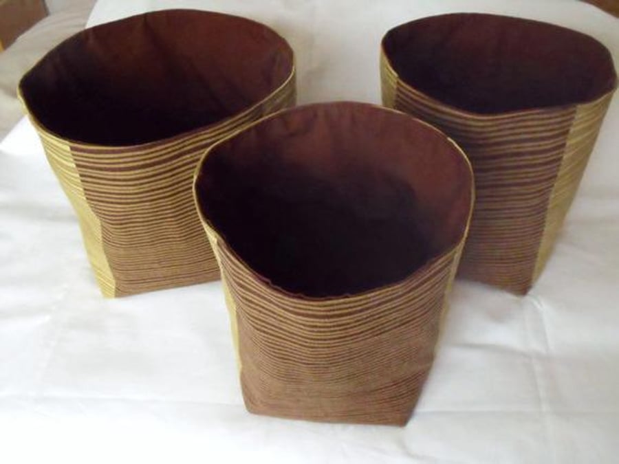 set of three graduated pistachio and brown cotton storage tubs for your nik nak 