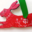 Scarlet hare  with white patterns