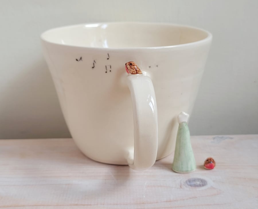 Handmade ceramic robin cup with bird prints and musical notes Pottery gift idea