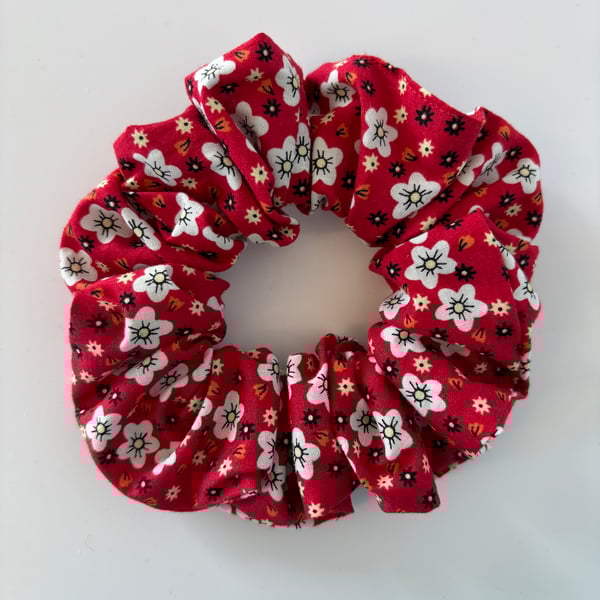 Cotton scrunchie hair accessory in a red and white floral print.