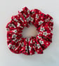 Cotton scrunchie hair accessory in a red and white floral print.