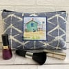 Large blue and white make up bag with beach hut decorative panel