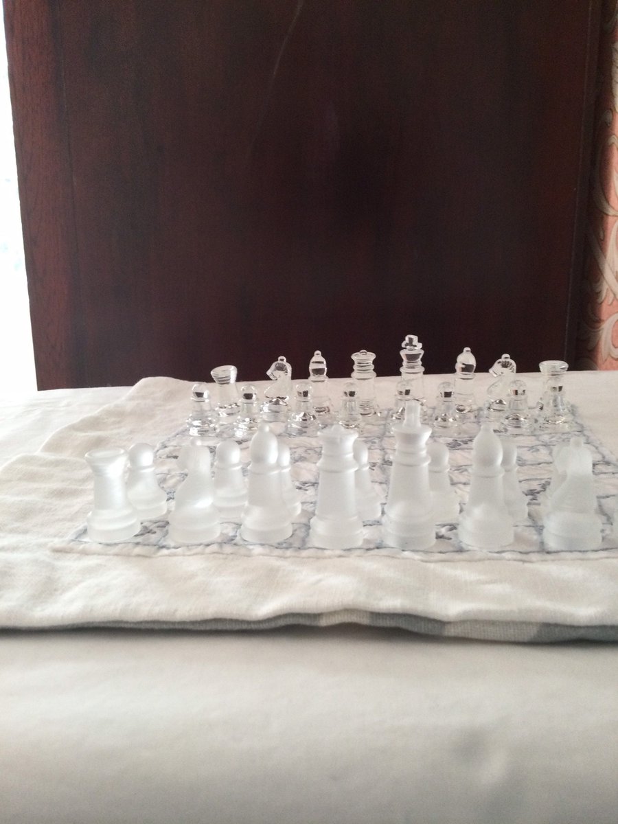 Hand embroidered chess board with glass pieces