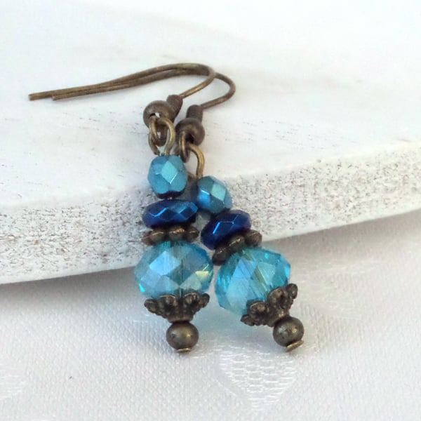 Vintage style bronze earrings with blue crystals