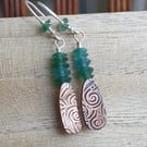 Copper swirl earrings with green glass beads, Sterling ear wires