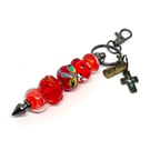 Handmade Vibrant Red Lampwork Glass Bead Bag Charm Keyring with added Charms