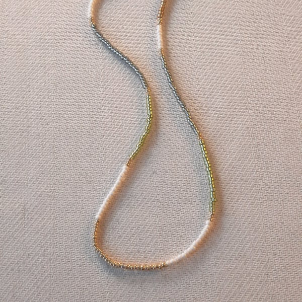 Glass beaded necklace, shades of green, cream, gold, 16 to 18 inches