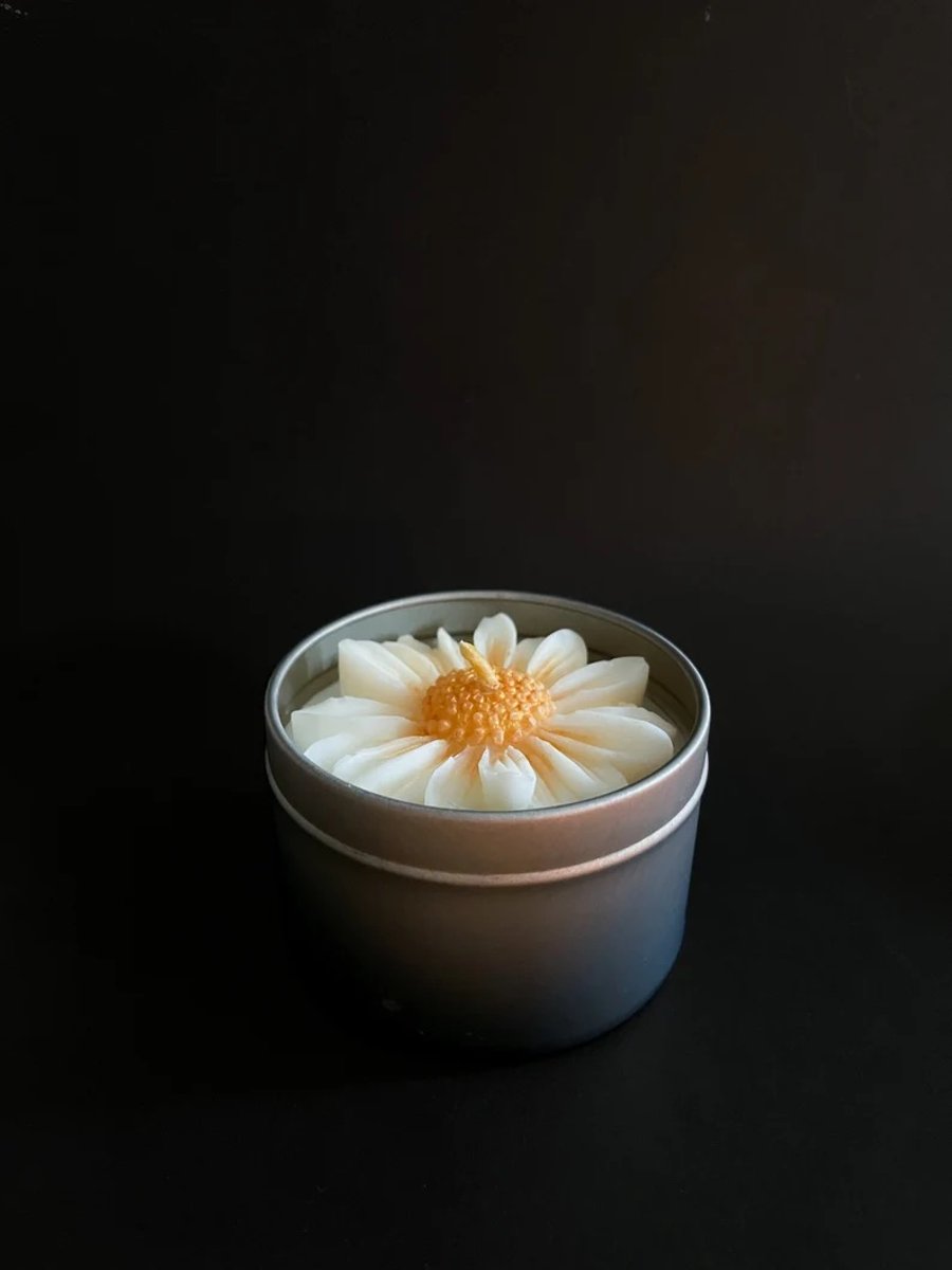 The Petty Soy Daisy Candle in the tin gold or silver 