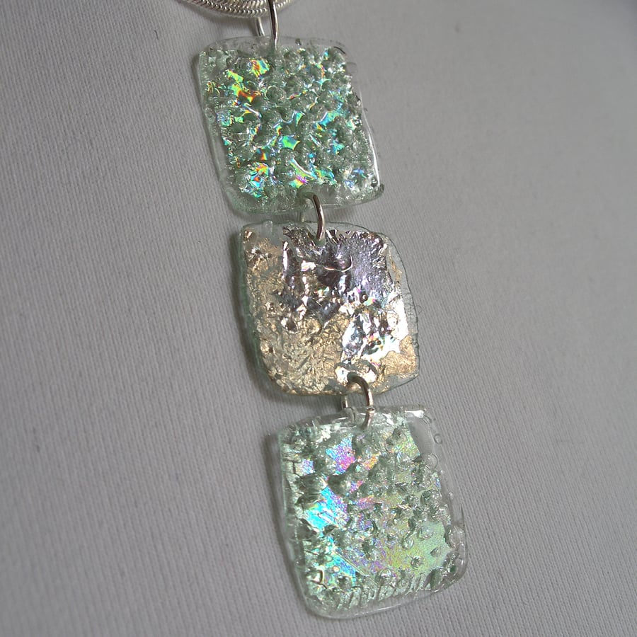 Three piece pendant. Silver and pale metallic green.