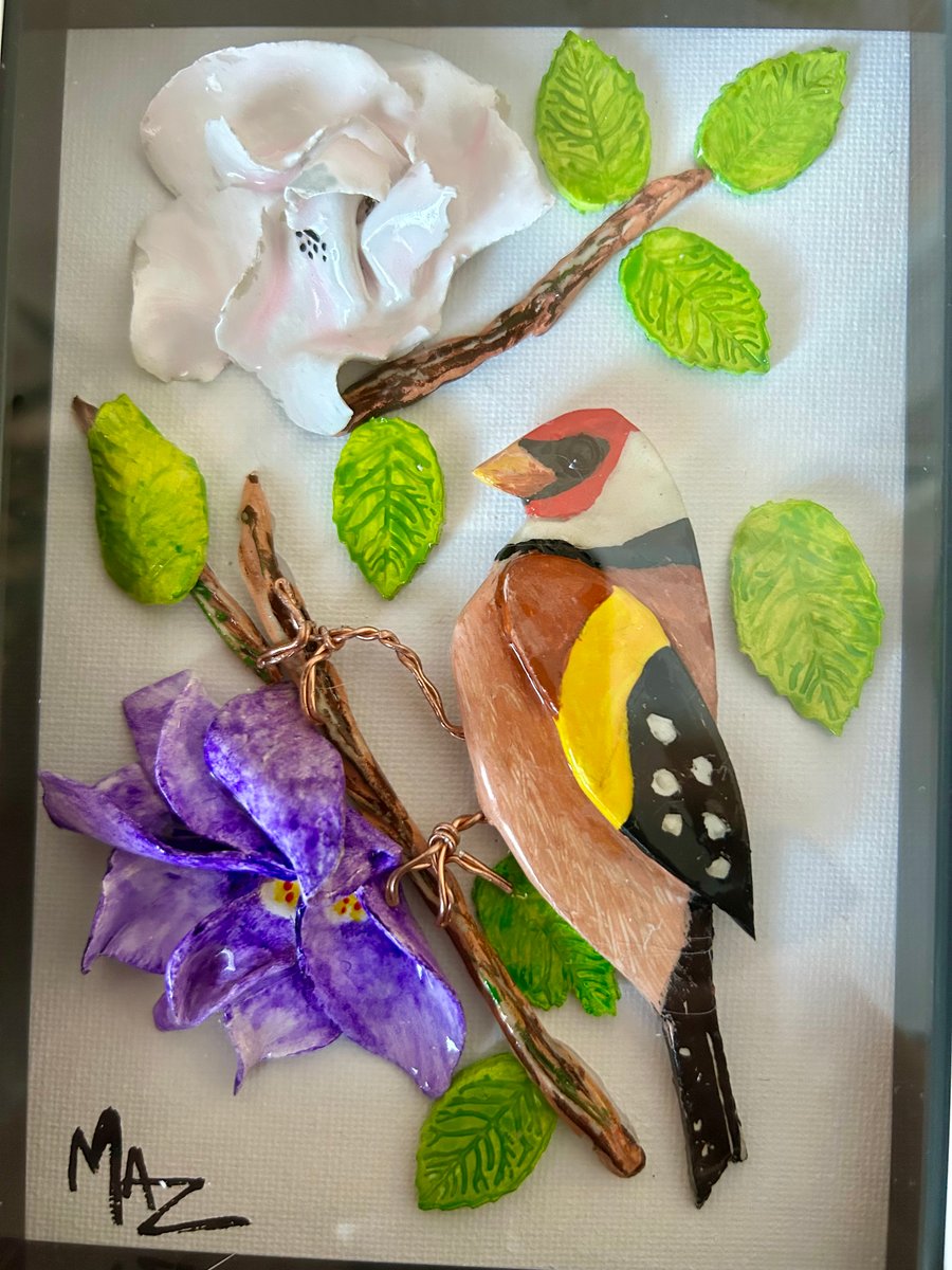 Bird and floral art in clay, beautiful Goldfinch with flowers