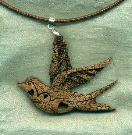 Swallow pendant with folk art design