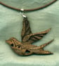 Swallow pendant with folk art design