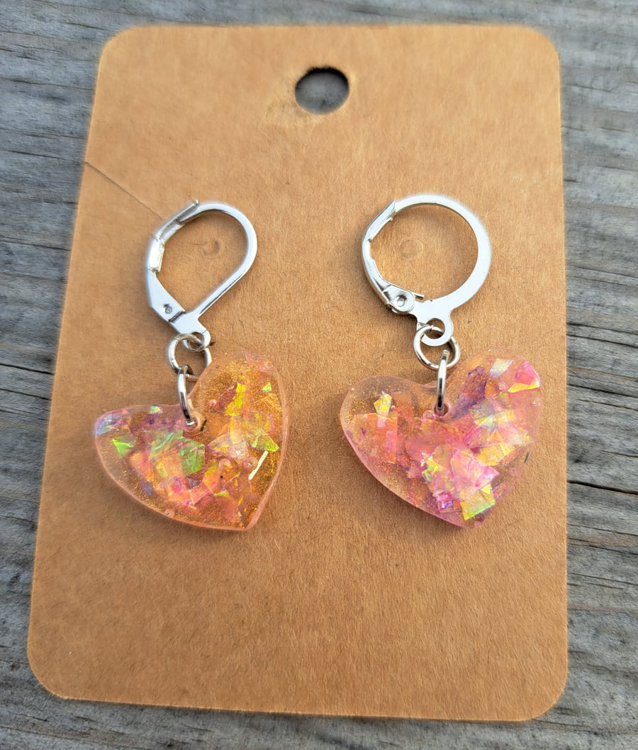 Small resin pair of handmade earrings with sparkles