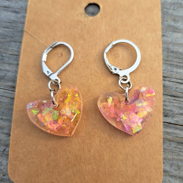 Small resin pair of handmade earrings with sparkles