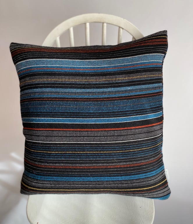 Magic City 1: Hand woven wool cushion, designed and by Yvonne Skelton