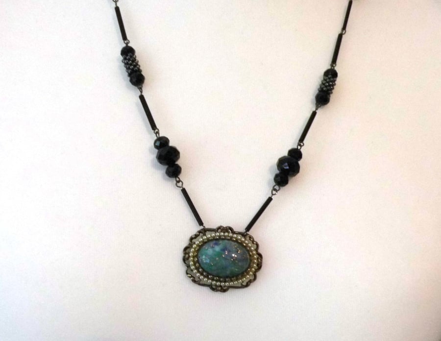 Upcycled long black and blue necklace reworked from vintage costume jewellery