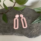 Statement earrings in pale pink 