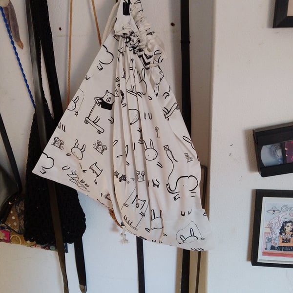 Handmade cotton laundry bag with drawstring closure