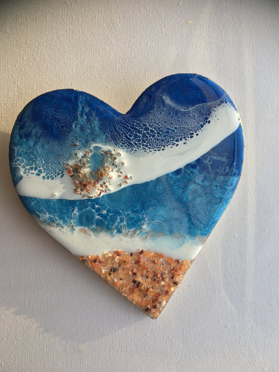 Heart, abstract ocean,  resin painting, shimmering blue, carnelian gemstones   