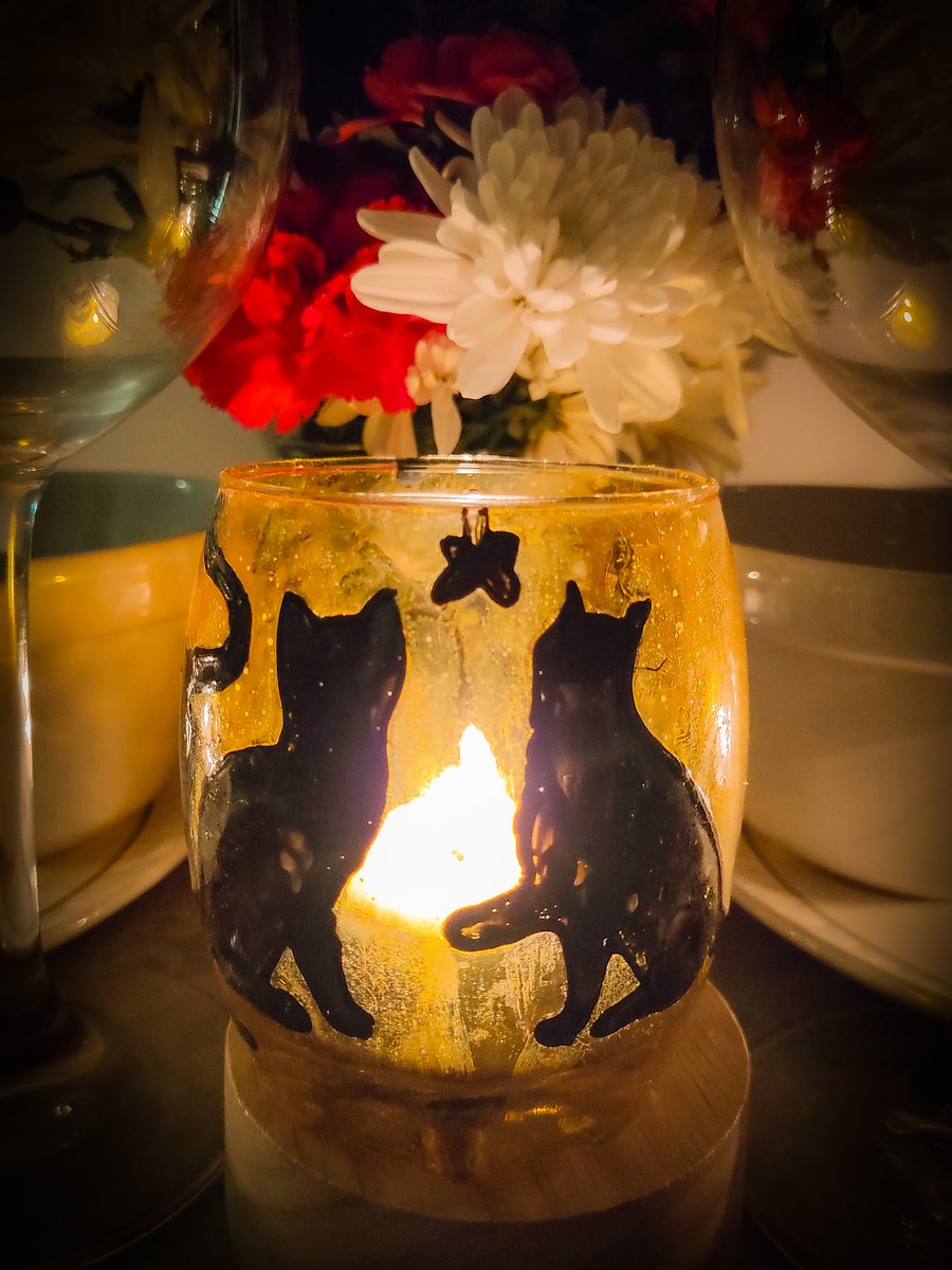 Glass painted yellow candle holder with black silhouettes of cats