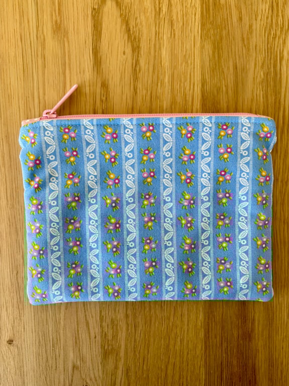 Zipped fabric pouch, purse, make up bag, in a vintage style blue floral print.