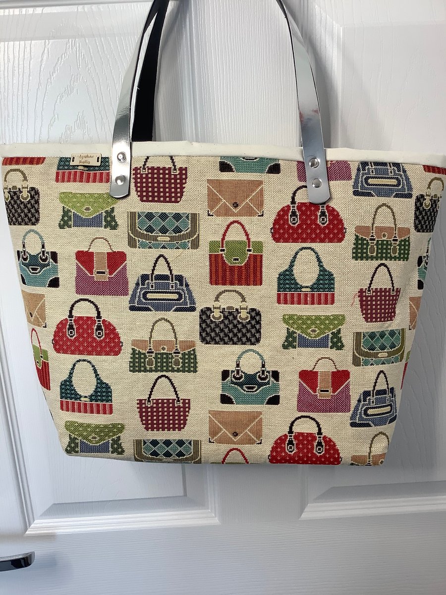 Super handy tote bag with Handbag design and fully lined,Silver Pu handles