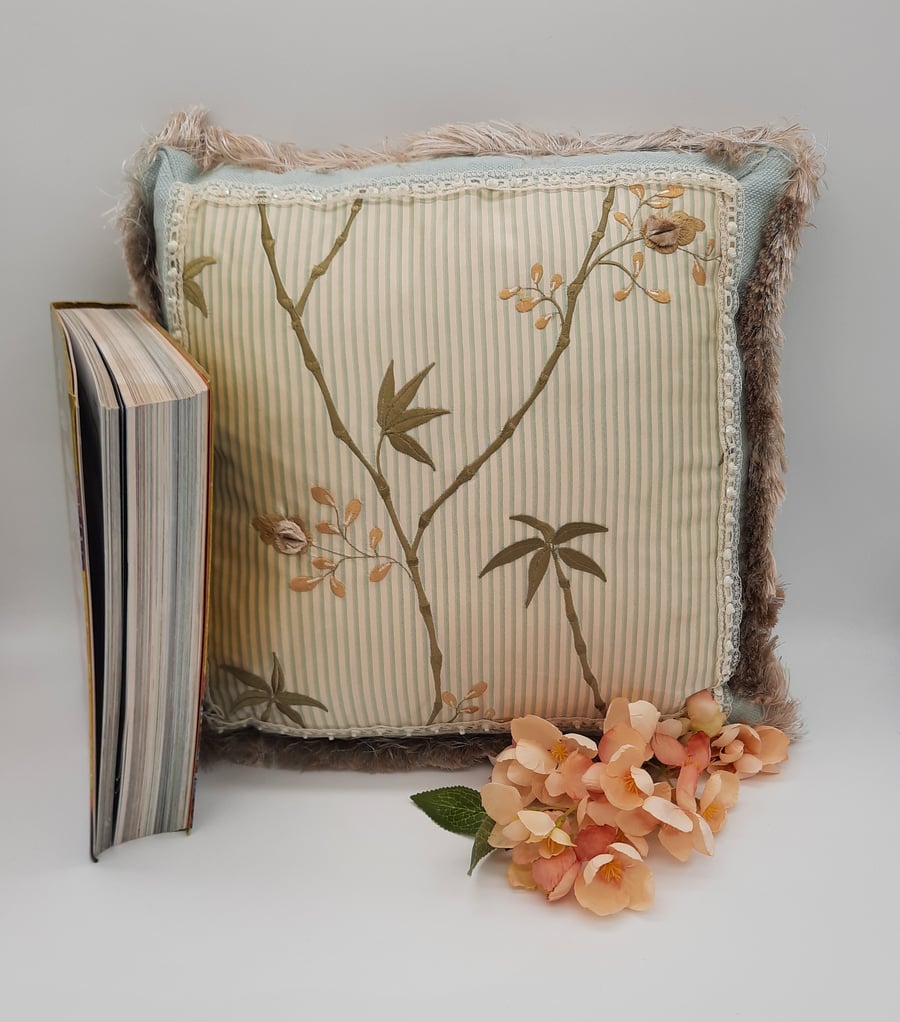 Green hand beaded feature cushion 