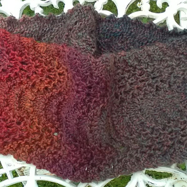 Handknit lacy textured circular scarf in multi reds and greens