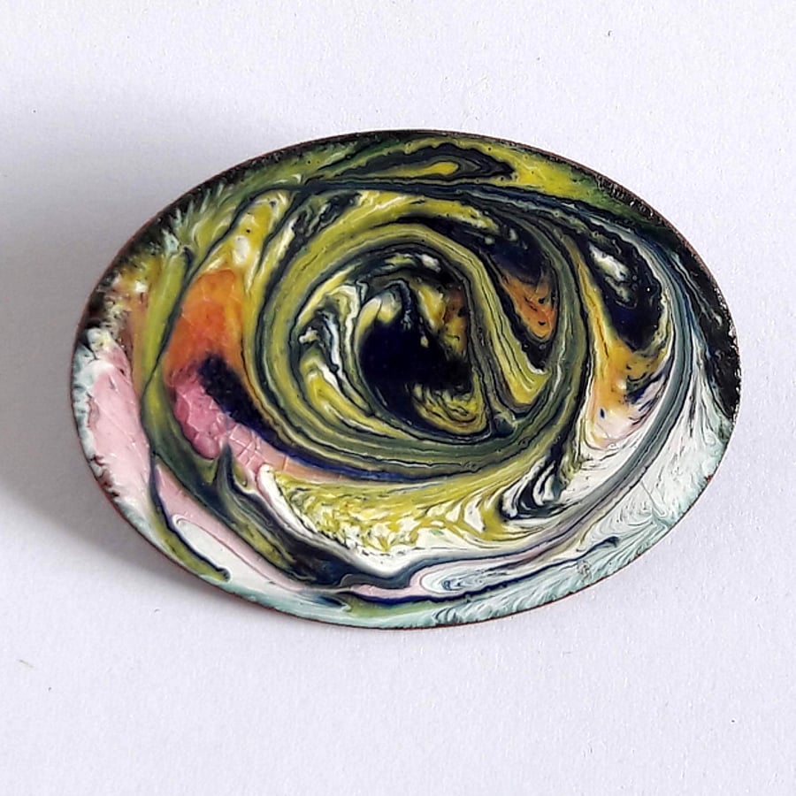 brooch - oval scrolled blue-black, gold and pink on white
