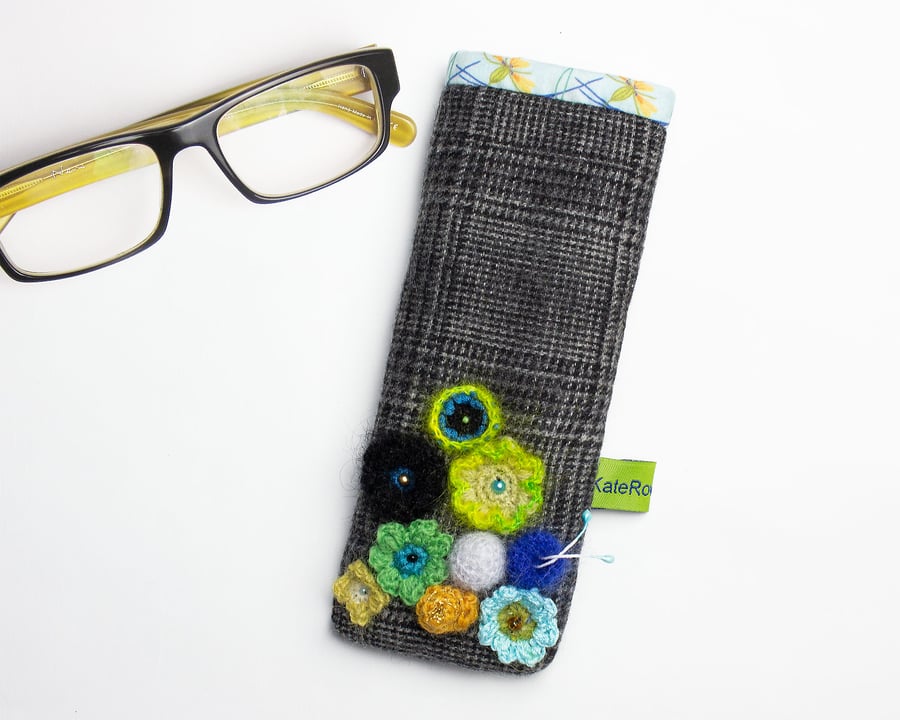 Prince of Wales check glasses case with green and blue crochet flowers