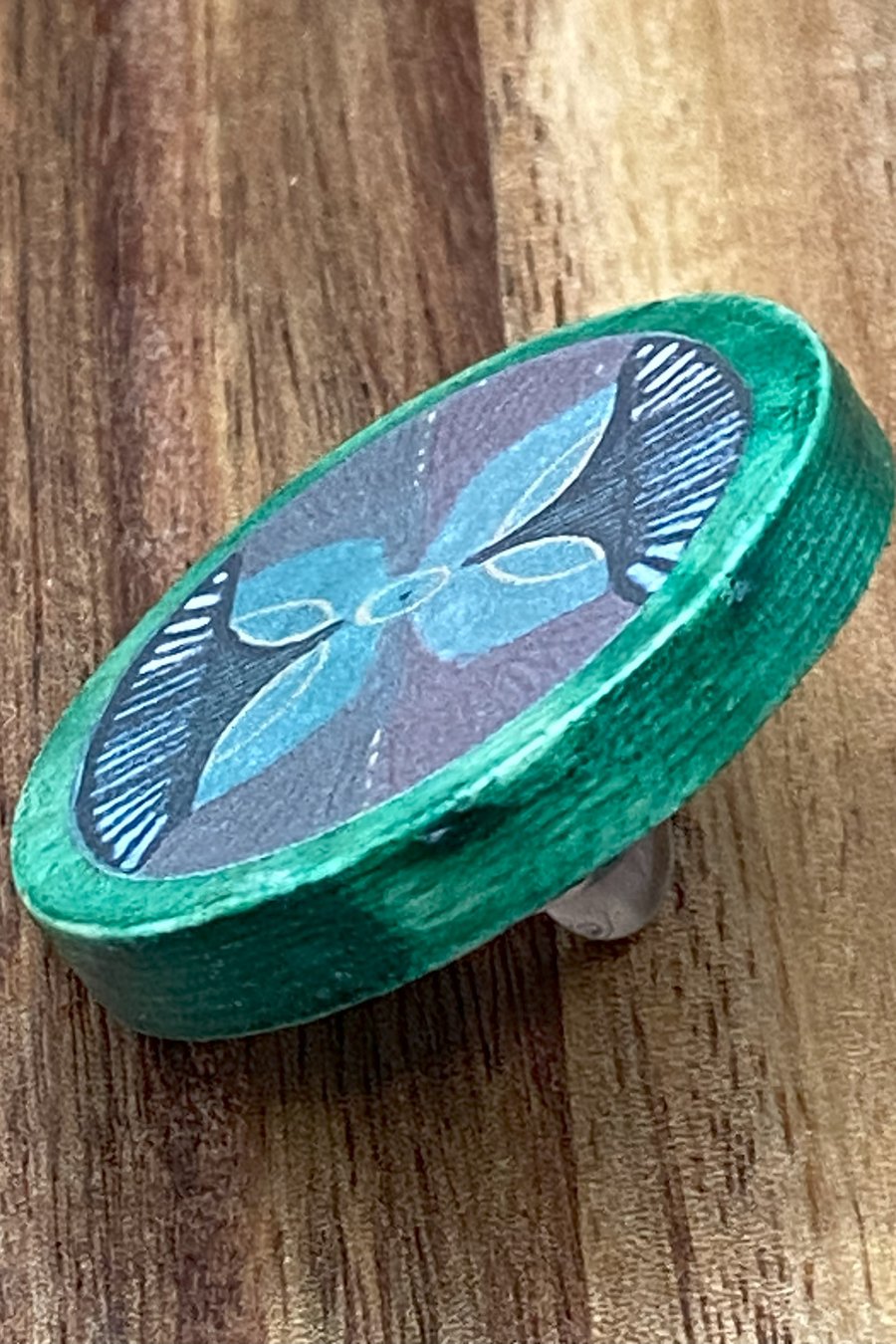 Handmade wooden brooch with floral motif