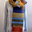 Multi colour scarf in autumnal colours, orange, green, ochre, blue,brown