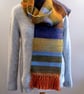 Multi colour scarf in autumnal colours, orange, green, ochre, blue,brown