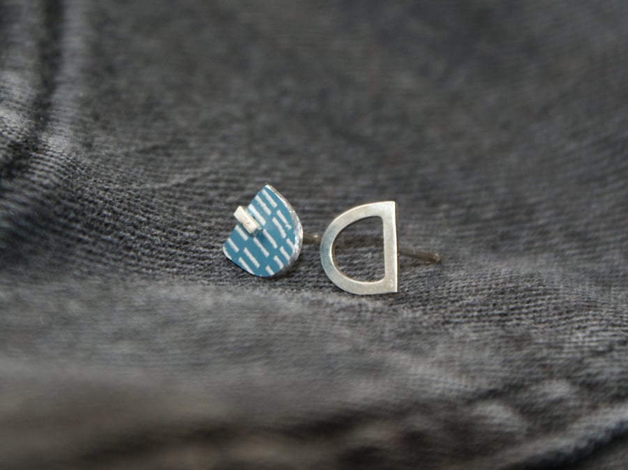Silver and dark blue mismatched studs