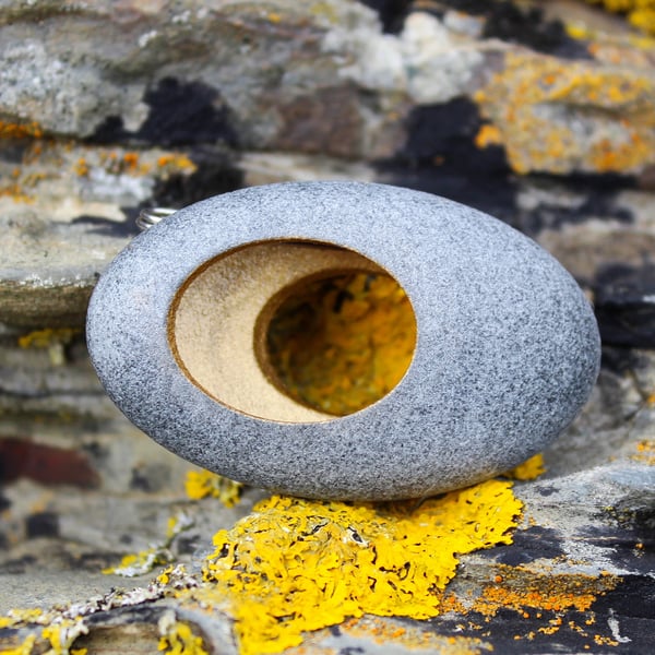 Pebble brooch, nature inspired with a golden hollow centre. A John Field design
