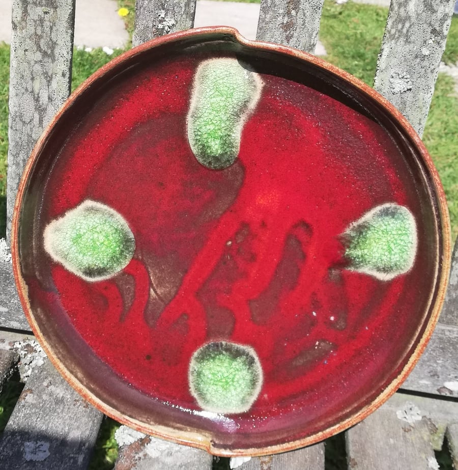 Stoneware brilliant crackle red glazed plate with green glass melt